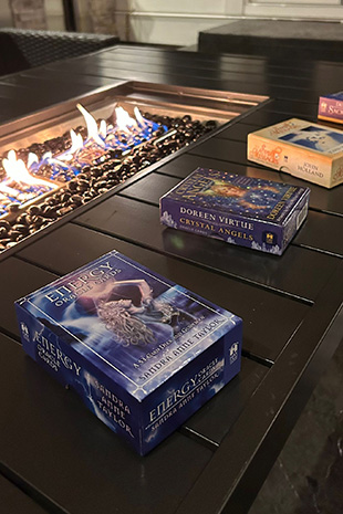 Oracle card decks used for spiritual guidance at crystal singing bowl Reiki healing event Maple Ridge